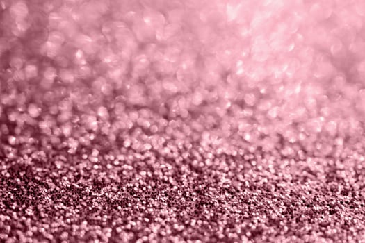 Abstract rose gold glitter sparkle texture with bokeh background photo
