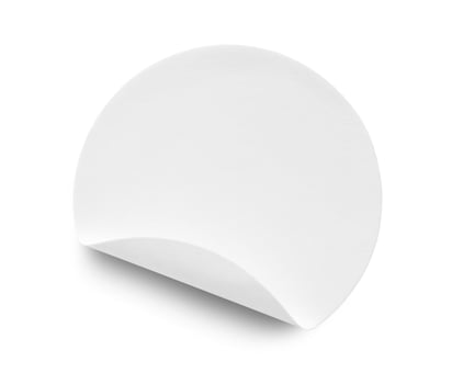 Blank white round paper sticker label isolated on white background photo
