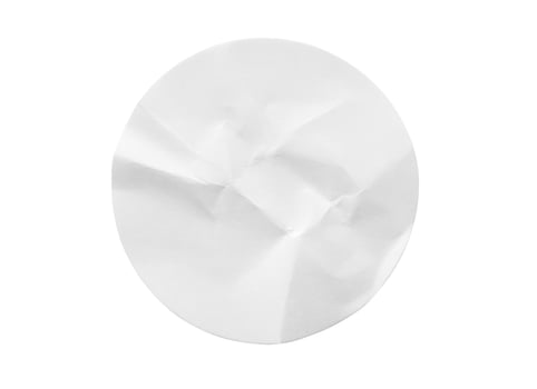 Blank white round paper sticker label isolated on white background photo
