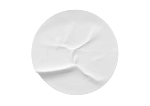 Blank white round paper sticker label isolated on white background photo