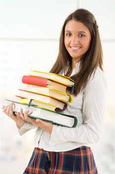 Happy Female student with books photo