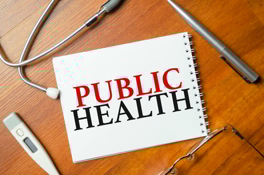word public health with stethoscope on wooden background photo