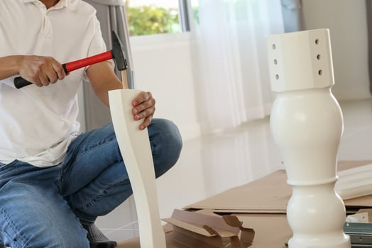 Man assembling furniture at home photo