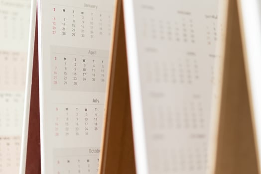 Close up calendar page dates and month background business planning appointment meeting concept photo