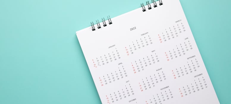 2022 calendar page on blue background business planning appointment meeting concept photo