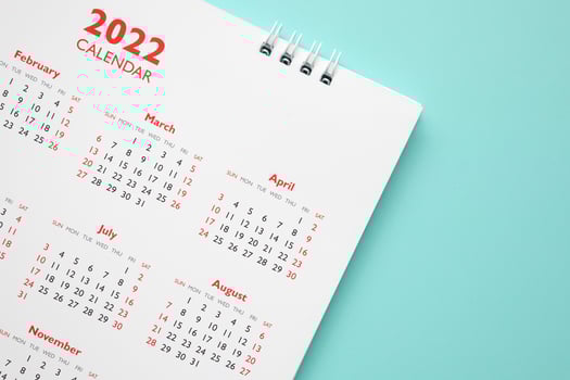 2022 calendar page on blue background business planning appointment meeting concept photo