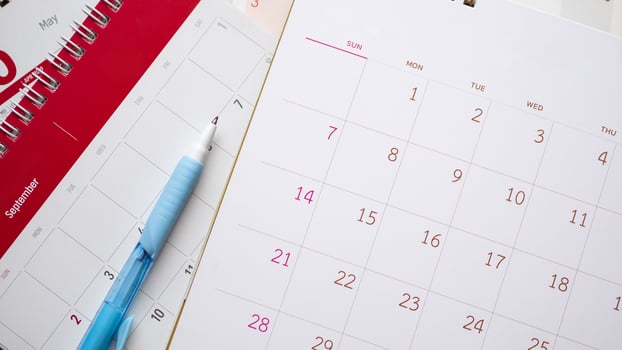 calendar page with pen close up background business planning appointment meeting concept photo