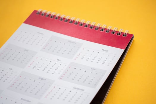 calendar page on yellow background business planning appointment meeting concept photo
