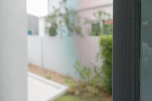 mosquito net wire screen on house window protection against insect photo