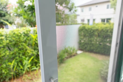 mosquito net wire screen on house window protection against insect photo