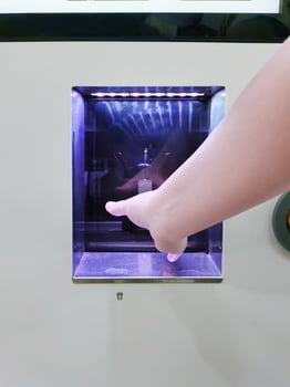 one hand at the window Coin-operated coffee machine photo