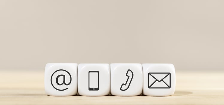 Contact us icons on white cube blocks photo