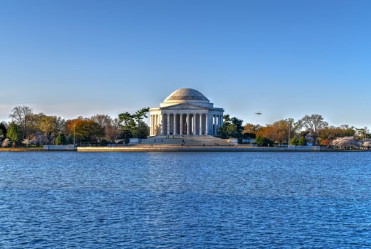 Jefferson Memorial and cherry blossoms at the Tidal Basin during spring in Washington, DC. photo