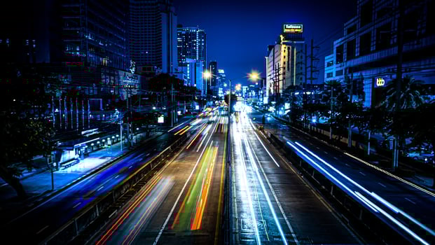 The light of cars running against each other with a low shutter shot in the middle of the capital Bangkok Thailand photo