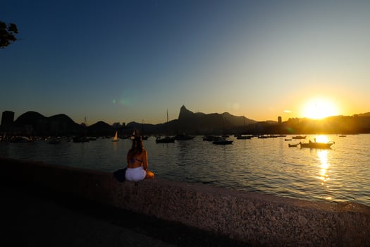 Rio de Janeiro, RJ, Brazil, 2022 - Sunset at district of Urca, traditional neighborhood in Rio de Janeiro - girl in silhouette photo