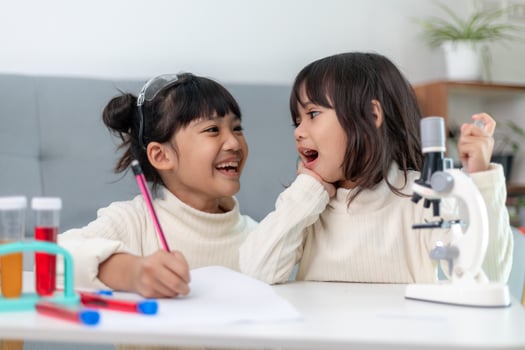 young girl play science experiments for homeschooling photo
