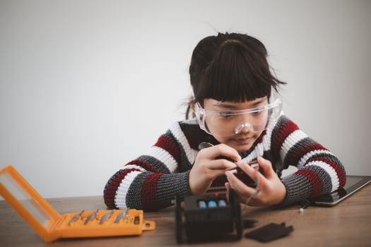 Asia students learn at home in coding robot cars and electronic board cables in STEM, STEAM, mathematics engineering science technology computer code in robotics for kids concept. photo