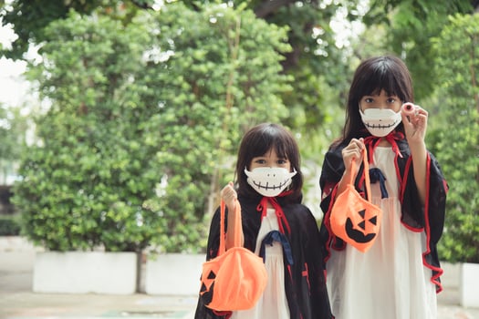 Children in costumes going to trick or treat photo