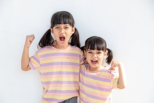 Positive siblings in similar clothes photo
