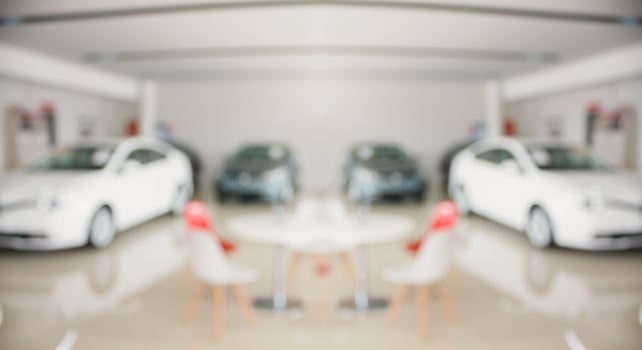 new cars in showroom interior blurred abstract background photo
