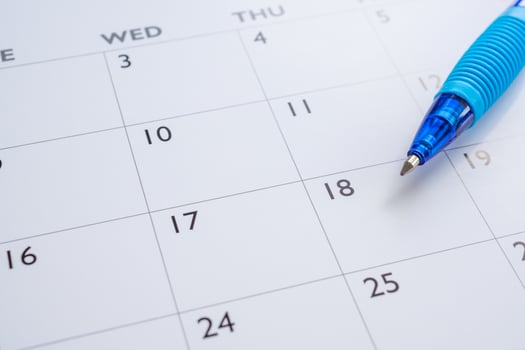 Blue pen on calendar page background business planning appointment meeting concept photo