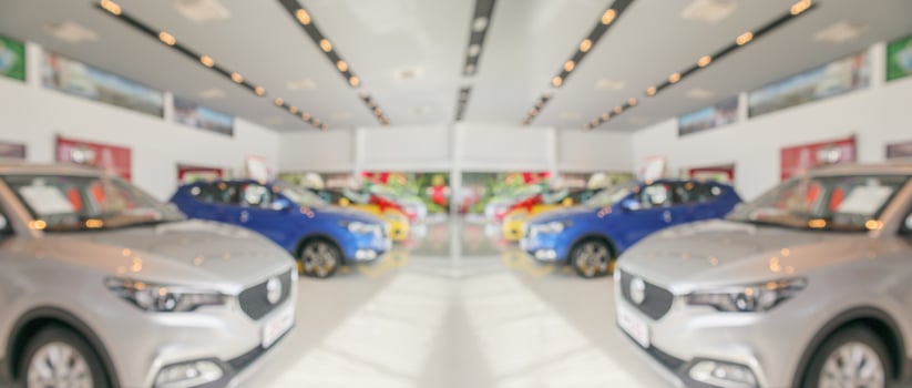 new cars in showroom interior blurred abstract background photo