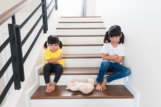 two little girl fighting over bear photo