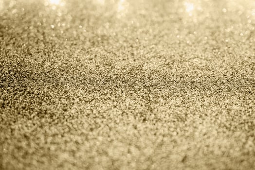 Abstract gold glitter sparkle with bokeh background photo