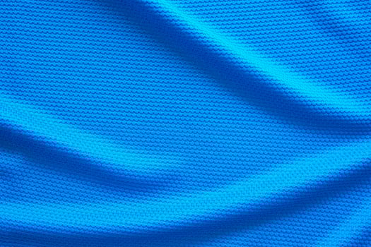 Blue football jersey clothing fabric texture sports wear background, close up top view photo