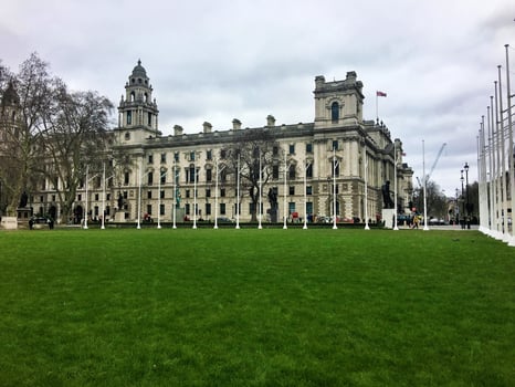 A large building with a lawn in front of it photo