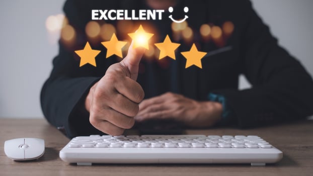 customer hand  with gold five star rating feedback icon and press level excellent rank for giving best score point to review the service, business concept photo