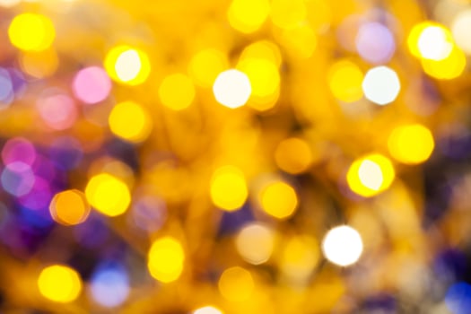 yellow pink blurred shimmering Christmas lights photo