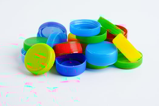 Plastic bottle caps colorful for recycle on white background. photo