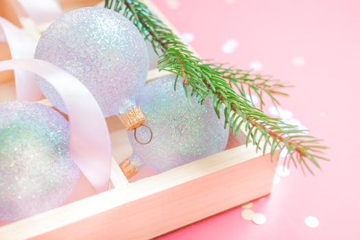 Christmas pearl decoration balls pink background photo