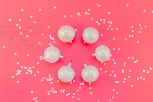 Christmas pink flat lay pattern with pearl balls photo
