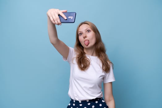 Isolated portrait of a cheerful young woman in elegant casual clothes photo