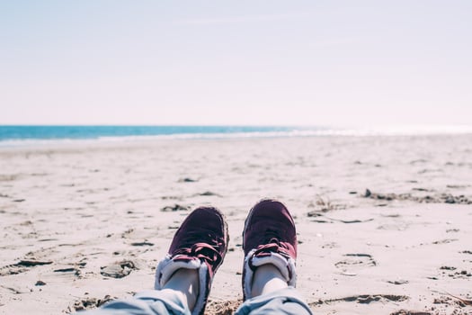Girl relaxing on sand beach photo