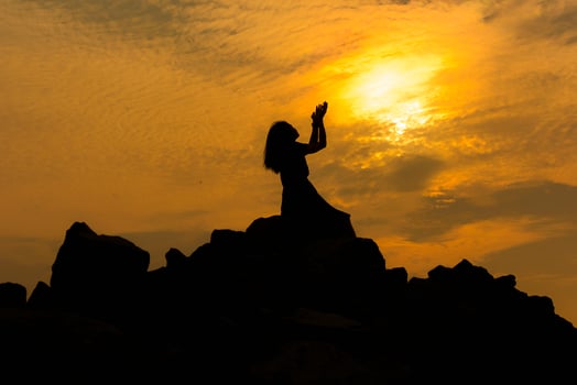 Silhouette sad girl at sunset. photo