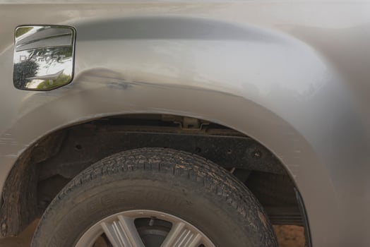 Paint scratched and damaged on the blond car. photo
