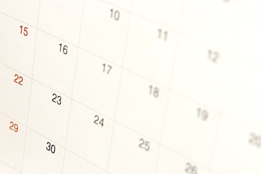 Dates on calendar page background,Closeup of numbers on calendar page photo
