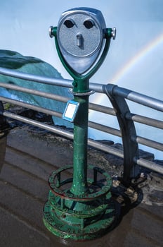 A viewing platform with a view of the falls in the background. photo