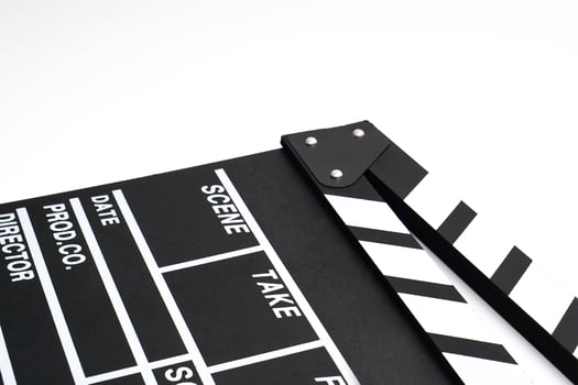 Clapperboard or movie slate black color on white background. Cinema industry, video production and film concept. photo