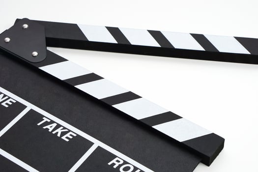 Clapperboard or movie slate black color on white background. Cinema industry, video production and film concept. photo
