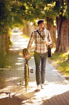 Casual Businessman Going To Work By Bike photo