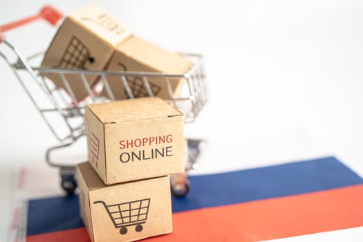Box with shopping online cart logo and Russia flag, Import Export Shopping online or commerce finance delivery service store product shipping, trade, supplier concept. photo