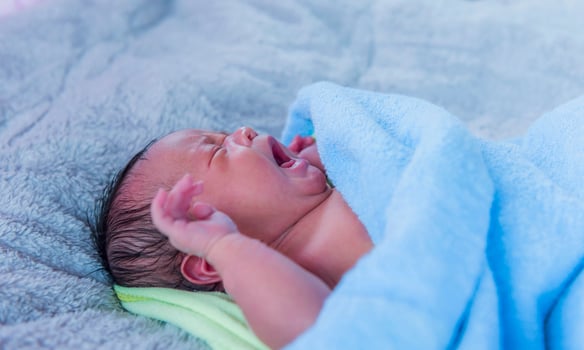 Close-up photo of a beautiful sleeping baby.
