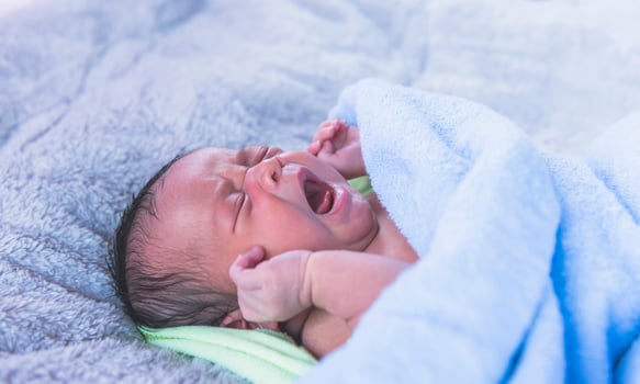 Close-up photo of a beautiful sleeping baby.