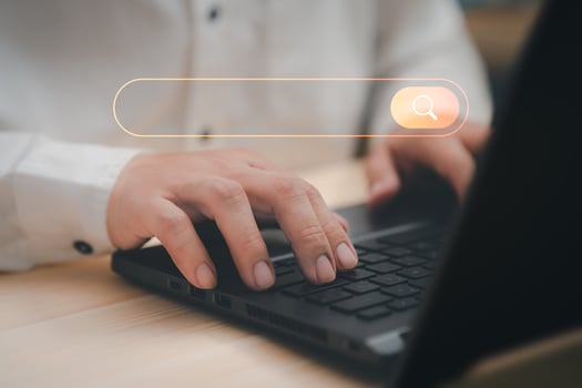 Freelance's hand working with computer laptop on desk in home. Searching Browsing Internet Data Information with blank search bar. Search Engine Optimization SEO Networking Concept. photo