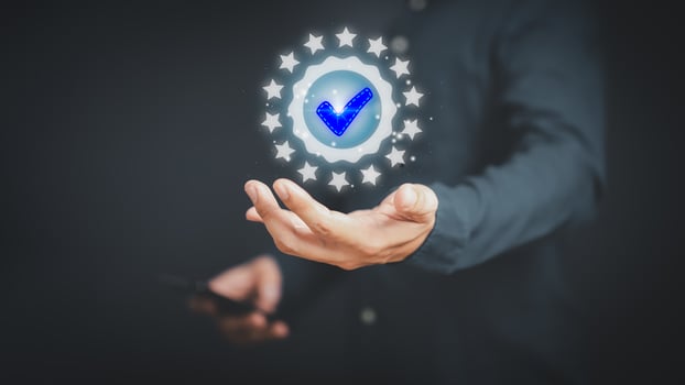 Quality assurance of business services, Businessman holding and showing the best quality assurance with golden five stars. Guarantee, Standards, ISO certification and testimonail concept. photo