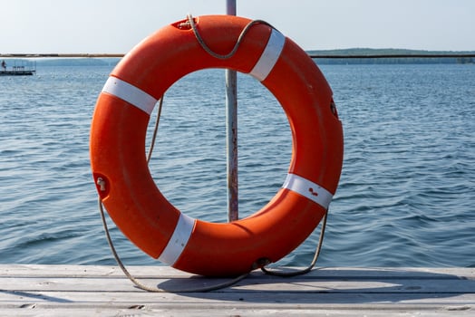 Lifebuoy hanging on the handle of the pier. The concept of saving drowning photo